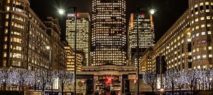 Lots of buildings lit up at night and close to where you can get an Asian massage with the escort girl of your choice at the London Marriott Hotel West India Quay