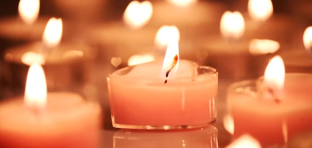 Lot of pink candles burning which is perfect for setting the scene during a sensual massage