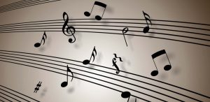 Lots of musical notes scattered all over a music sheet to reflect why soothing music is great for a sensual massage
