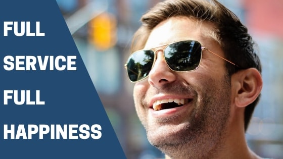 A man laughing in his sunglasses, just after he has been for a full service massage
