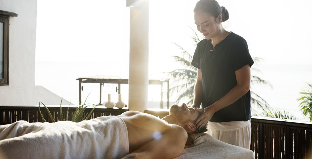 A male client getting an Asian body to body massage
