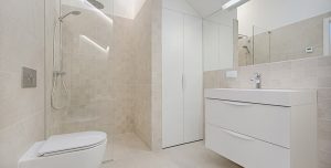 A modern contemporary white bathroom
